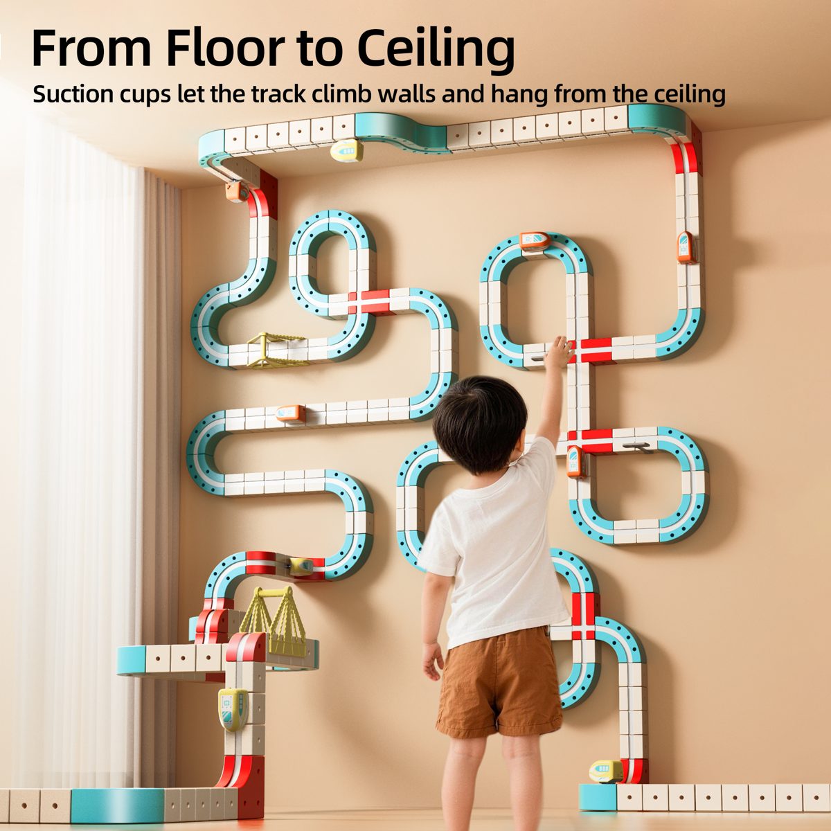 Track climbing a wall with suction cups